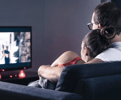 Couple on the couch watching TV